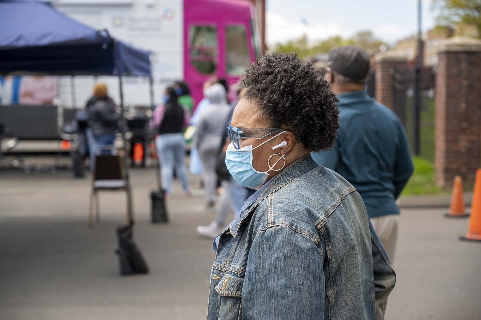 Patrice Evans waits in line at a newly opened COVID-19 mobile testing center in the north end of Hartford on May 12. It is the city’s  first walk-up mobile testing site. (Tyler Russell/Connecticut Public
