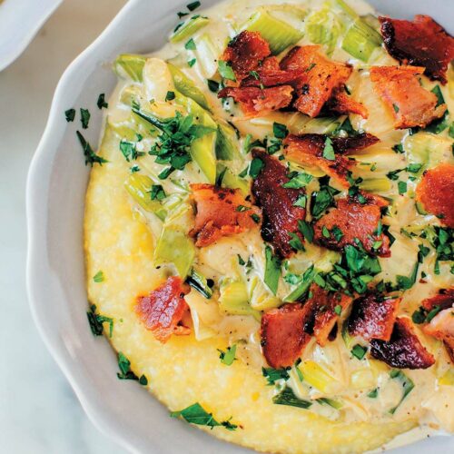 Grits with Scallions and Bacon recipe Excerpted from Onions Etcetera: The Essential Allium Cookbook by Kate Winslow and Guy Ambrosino. Copyright © 2017 by Kate Winslow and Guy Ambrosino. Published by Burgess Lea Press.