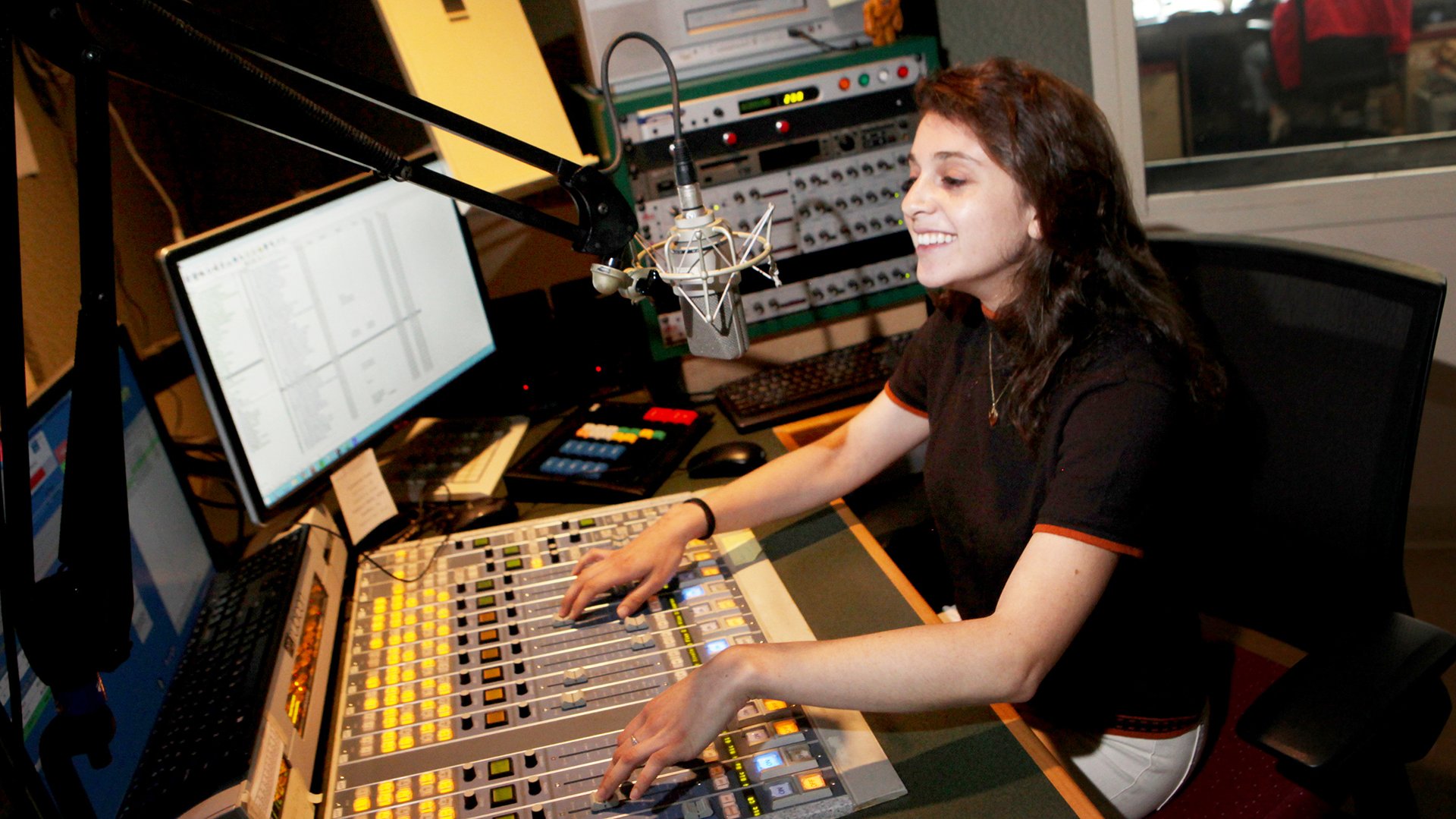 Radio intern Xandra Ellin runs the board during one of Connecticut Public Radio’s local talk shows.