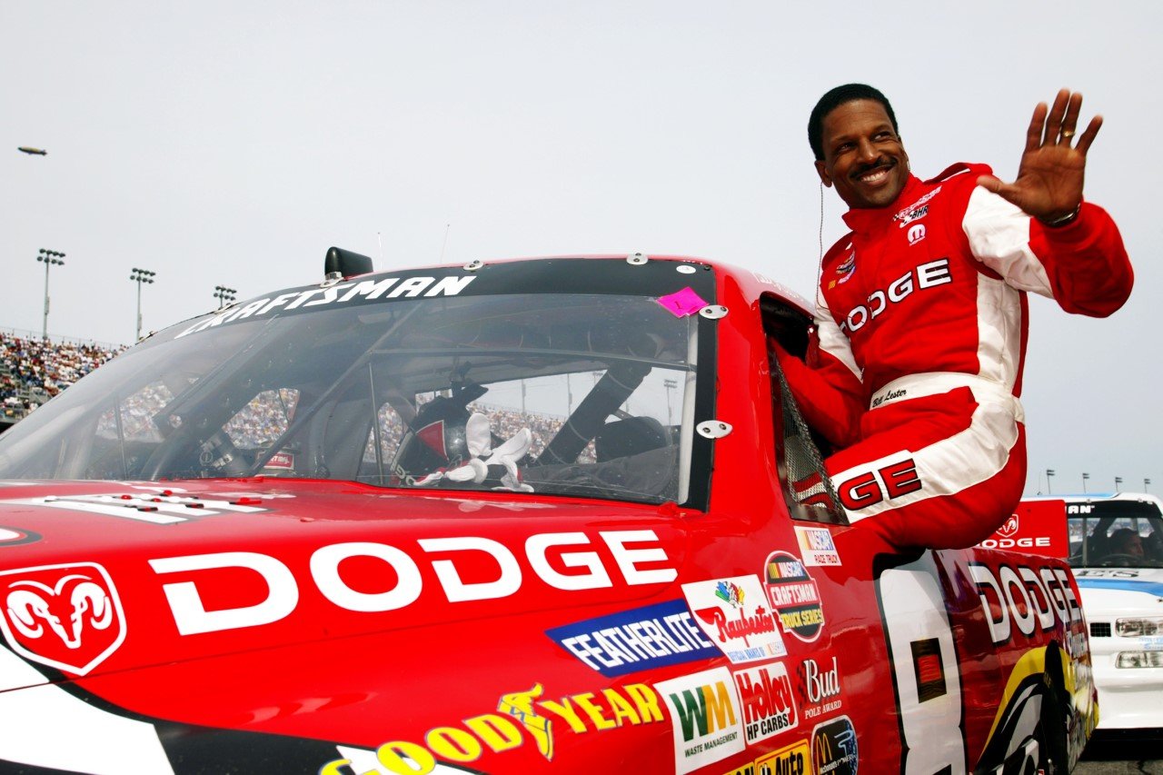 Bill Lester #8 climbs into his Dodge Motorsports Dodge prior to the NASCAR Craftsman Truck Series Florida Dodge Dealers 250 at the Daytona International Speedway on February 14, 2003 in Daytona, Florida.  (Photo by Jamie Squire/Getty Images)