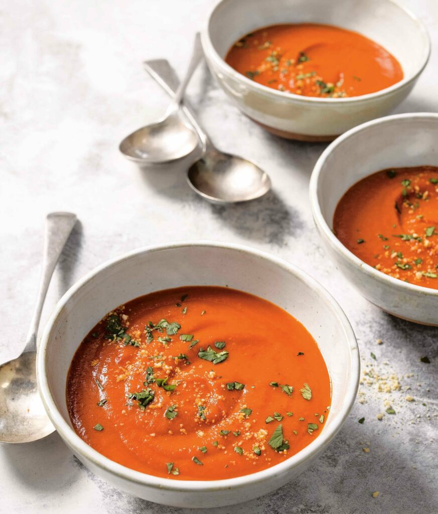 tomato and coconut soup recipe. Reprinted from Fix It With Food: Every Meal Easy” Copyright © 2021 by Michael Symon and Douglas Trattner. Photographs copyright © 2021 by Ed Anderson. Illustrations copyright © 2021 by Stanley Chow. Published by Clarkson Potter, an imprint of Random House.