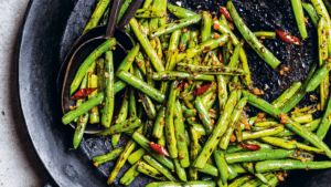 Dry-Fried Green Beans excerpted from Flavor+Us: Cooking for Everyone by Rahanna Bisseret Martinez.