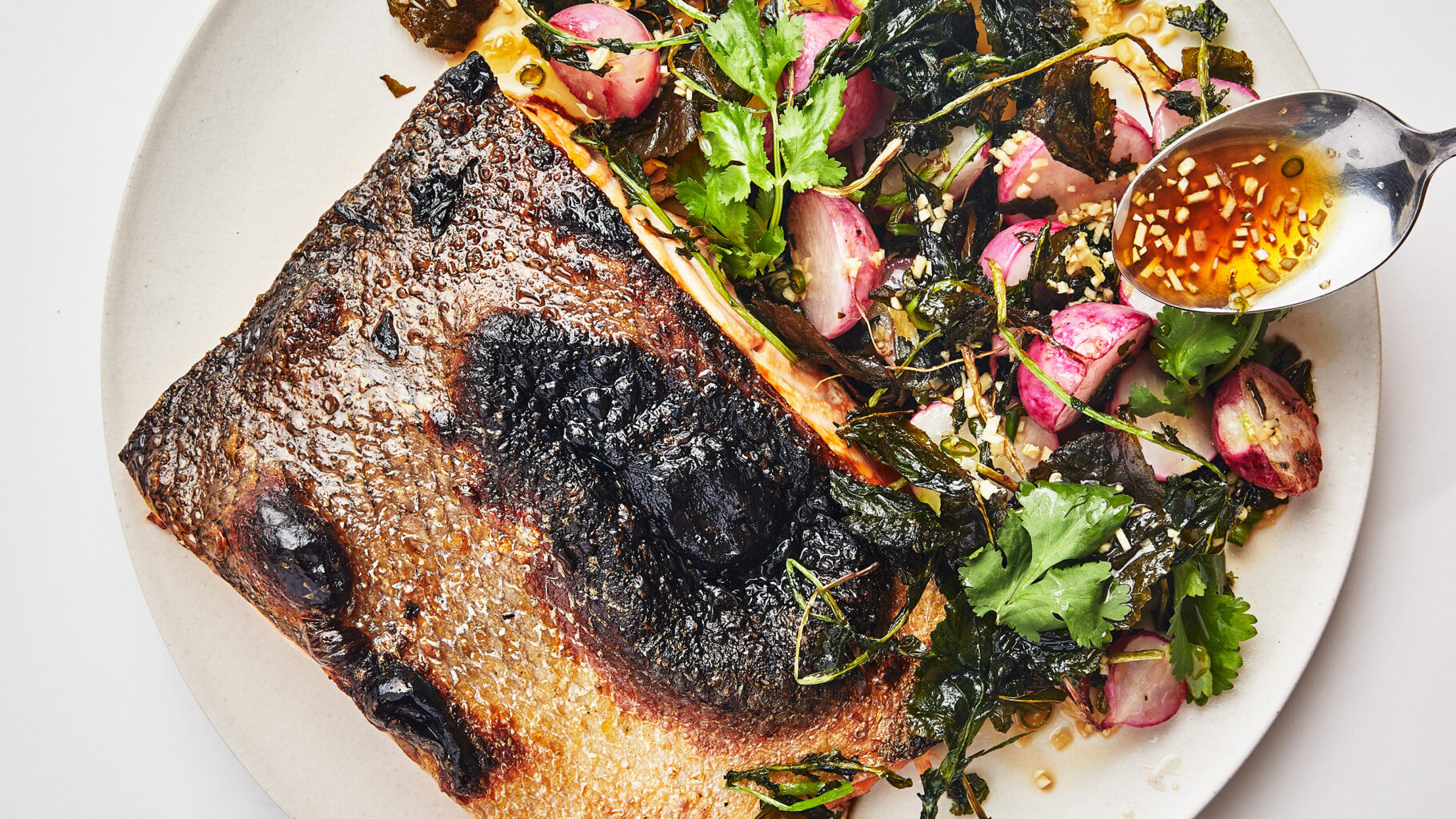 Sohla El-Waylly ‘s Crispy-Skinned Salmon with Radishes & Nuoc Cham recipe. Photo by Laura Murray